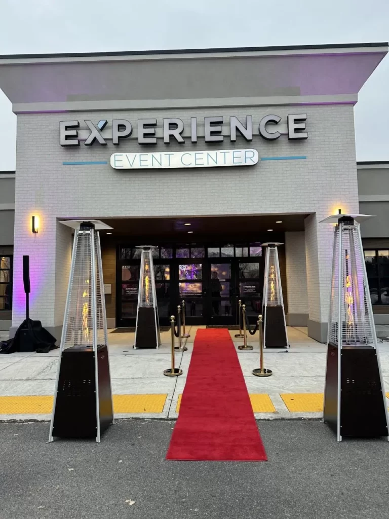 Front doors to Experience Event Center with red carpet and portable heaters