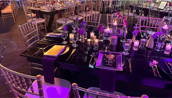 Banquet tables with place settings and chairs
